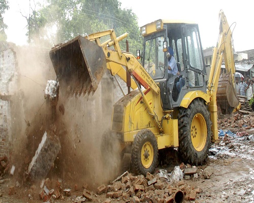 up-minister-sharda-pratap-shukla-run-bulldozer-on-his-property